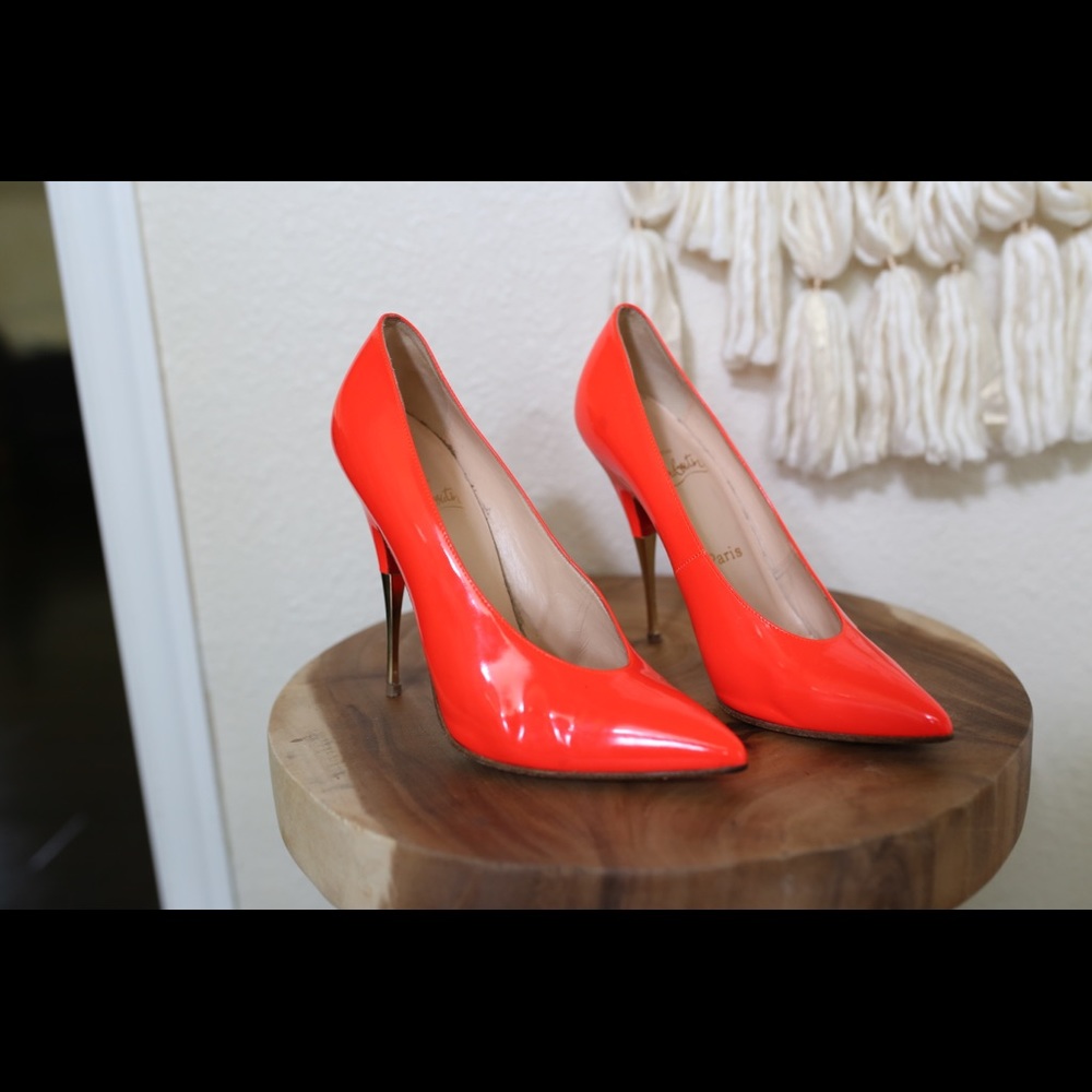 Orange Christian Louboutin pumps
